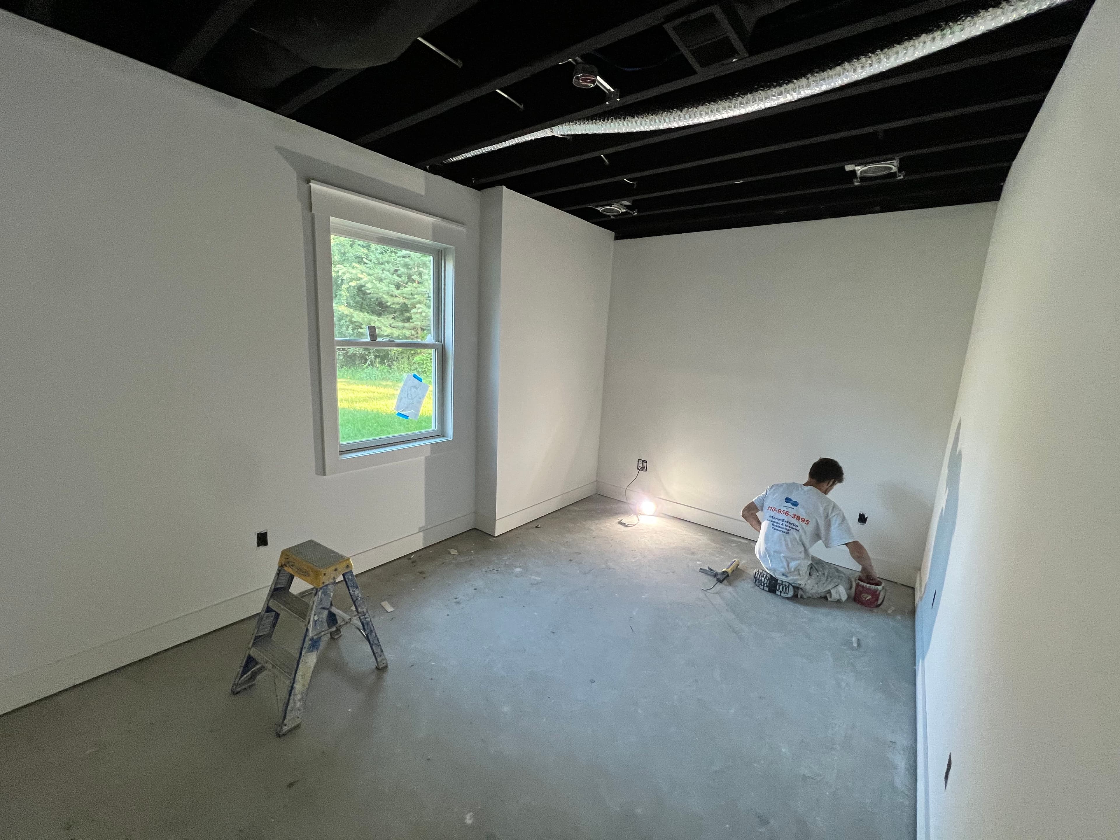 Project Basement Finish Gets a Sharp Black Ceiling and Clean Painted Walls image
