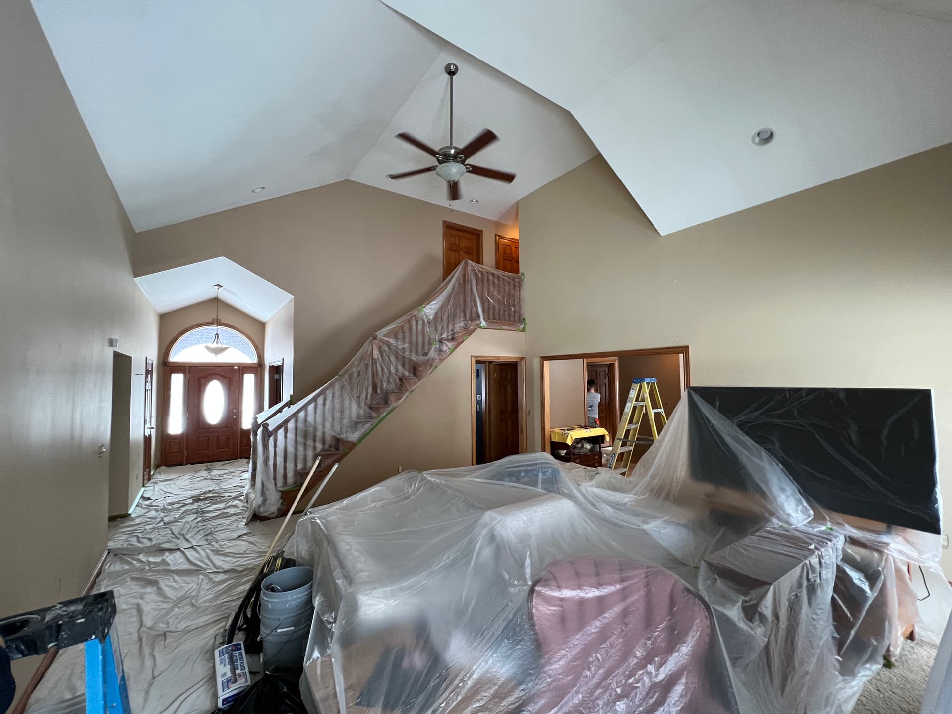 Tackling Smoke Stains and Tall Ceilings on a Large Interior Paint Job image