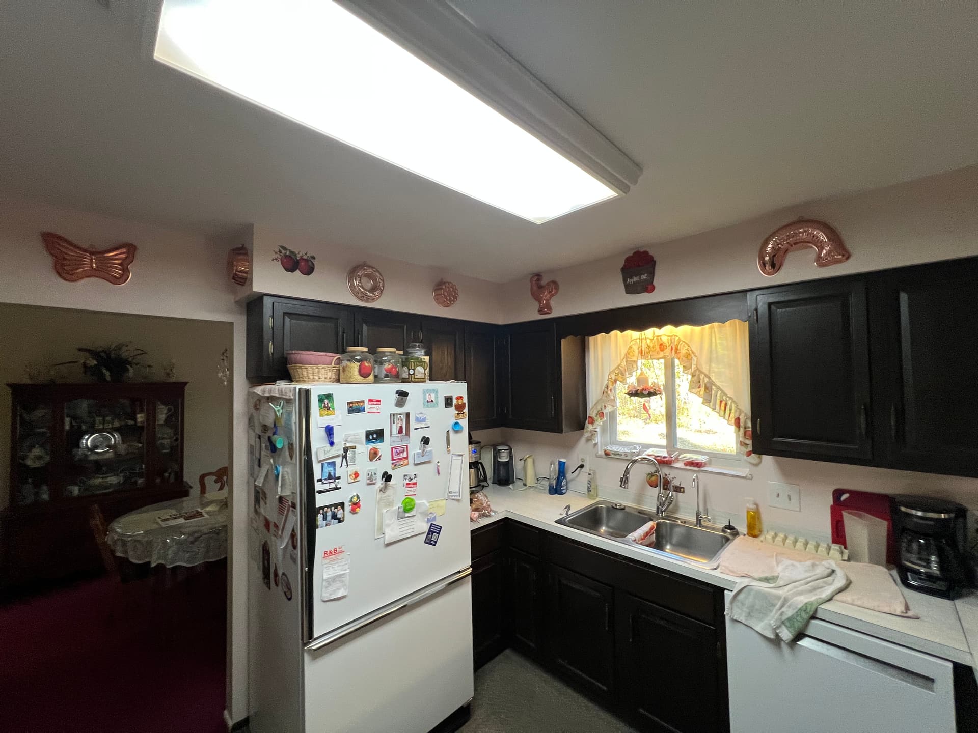 Dark Kitchen Cabinets Refinished Bright White Without the Remodel image
