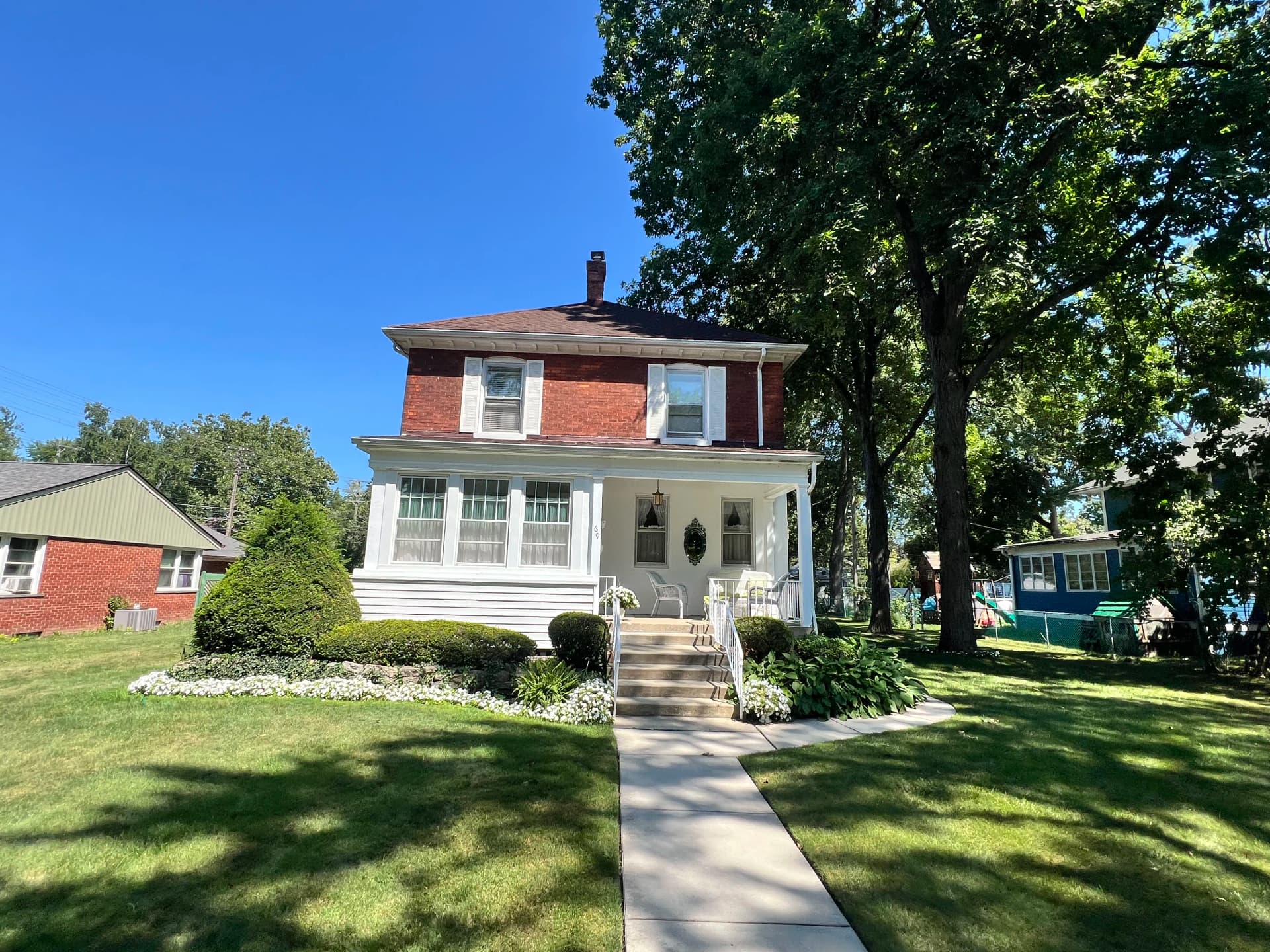 Full Exterior Brick Home and Deck Paint Overhaul image