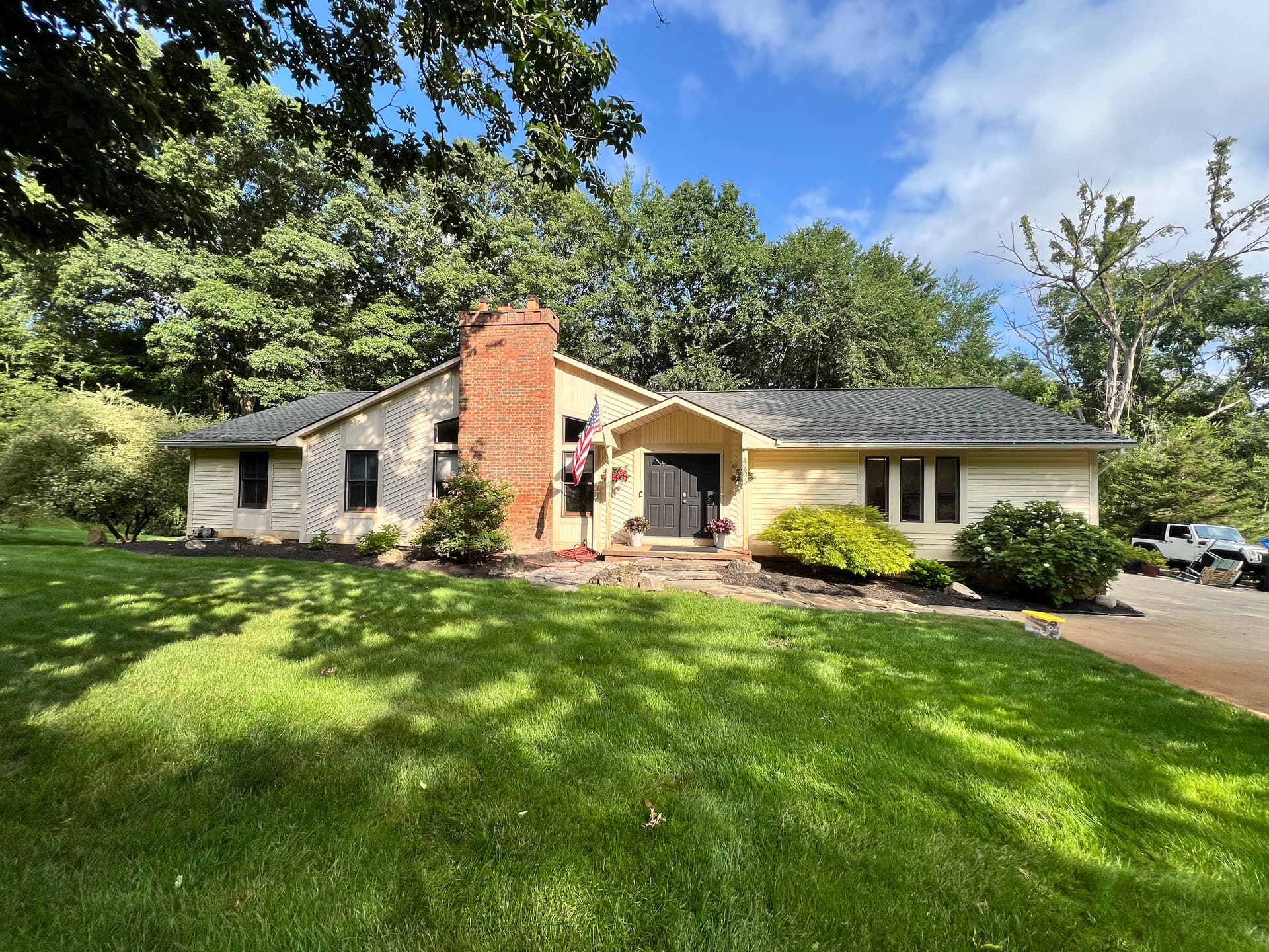 White Siding, Black Brick, Fresh Deck - Full Home Exterior Repaint image