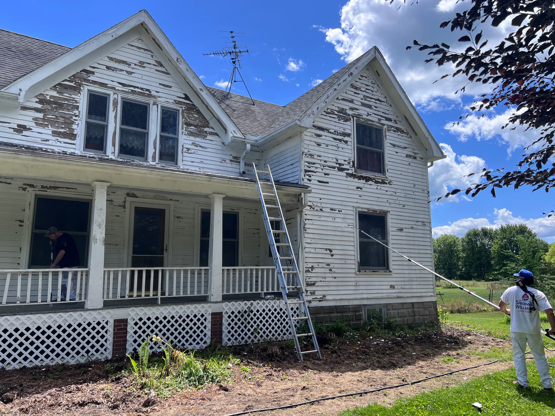 Peeling Wood Siding and Porch Gets a Full Exterior Paint Overhaul image